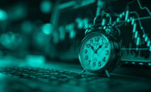 Intraday Trading Guide: Clock overlayed with trading candlesticks.